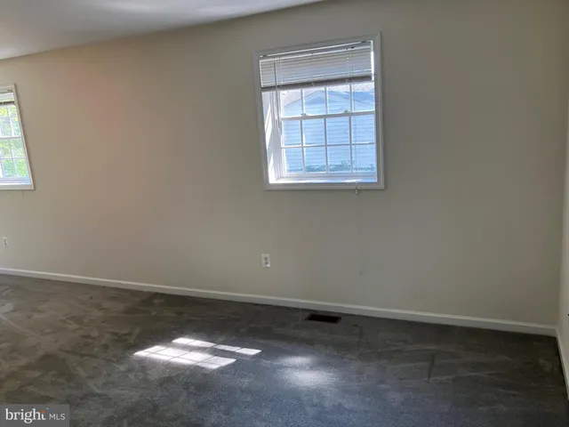 an empty room with closet area