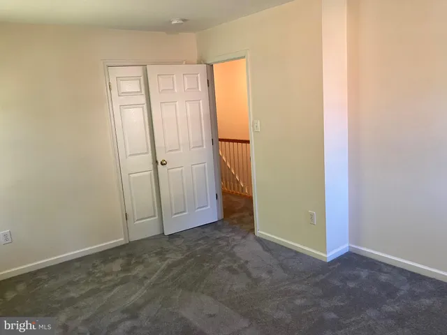 a bathroom with a granite countertop bathtub shower and toilet
