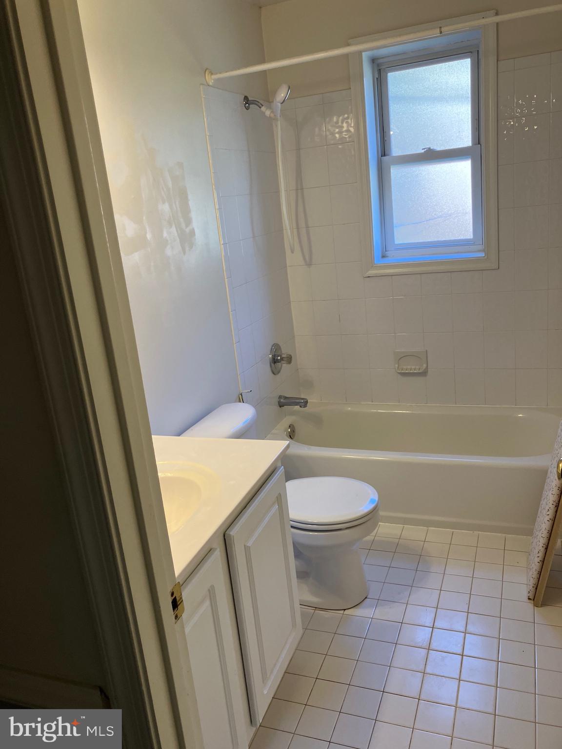 10316 Royal Road Silver Spring, MD 20903 - Photo 38 of 46 a bathroom with a granite countertop bathtub shower and toilet