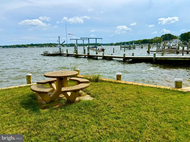 a view of a lake with boats in front of it
