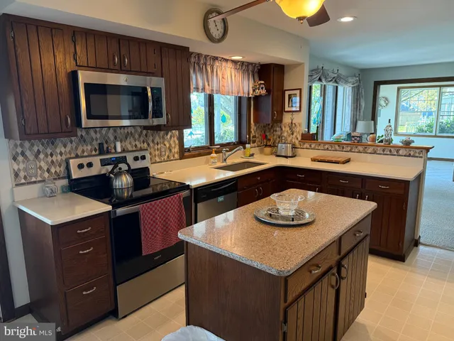 a kitchen with a stove and a microwave