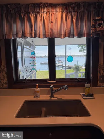 a bathroom with sink and mirror