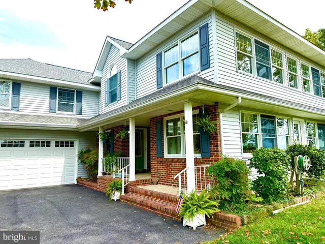 a view of a house with a outdoor seating space