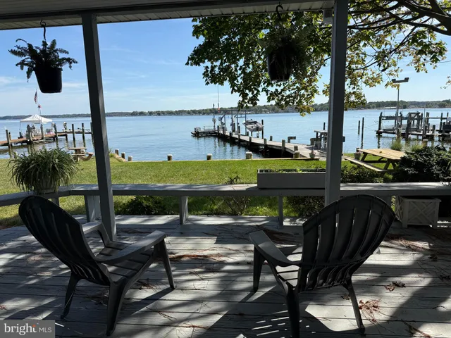 a view of a chairs and table in patio