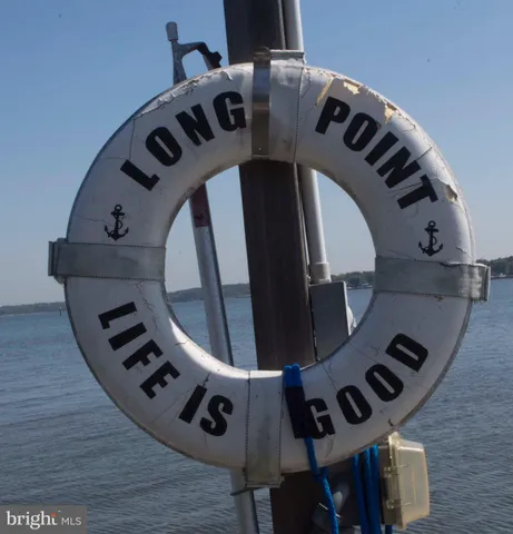 an view of entryway and hall with wooden floor