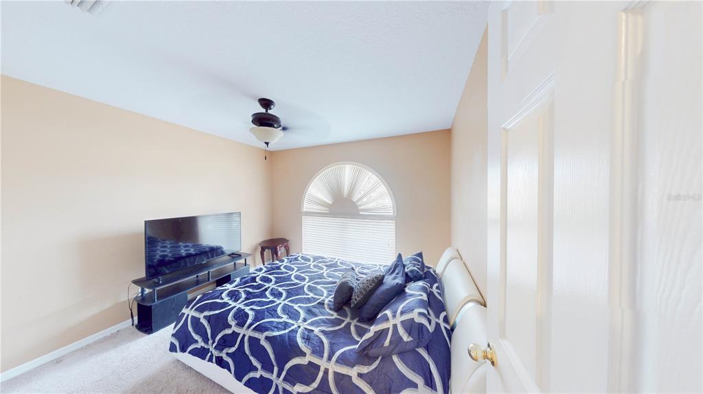 1103 Mallory Point Drive Valrico, FL 33596 - Photo 3 of 21 a bed room with a bed and a window