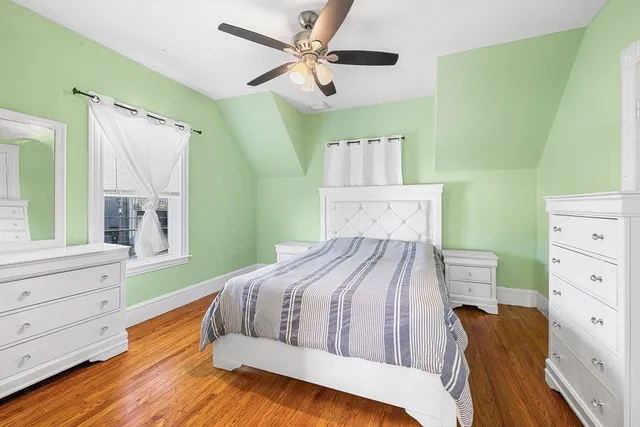 a bedroom with a bed and a dresser