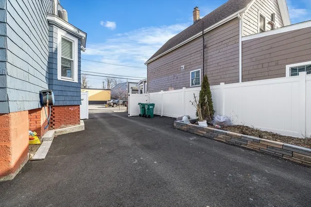 a view of a street with seating area