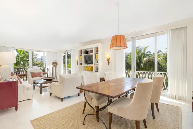 a view of a dining room with furniture wooden floor and chandelier