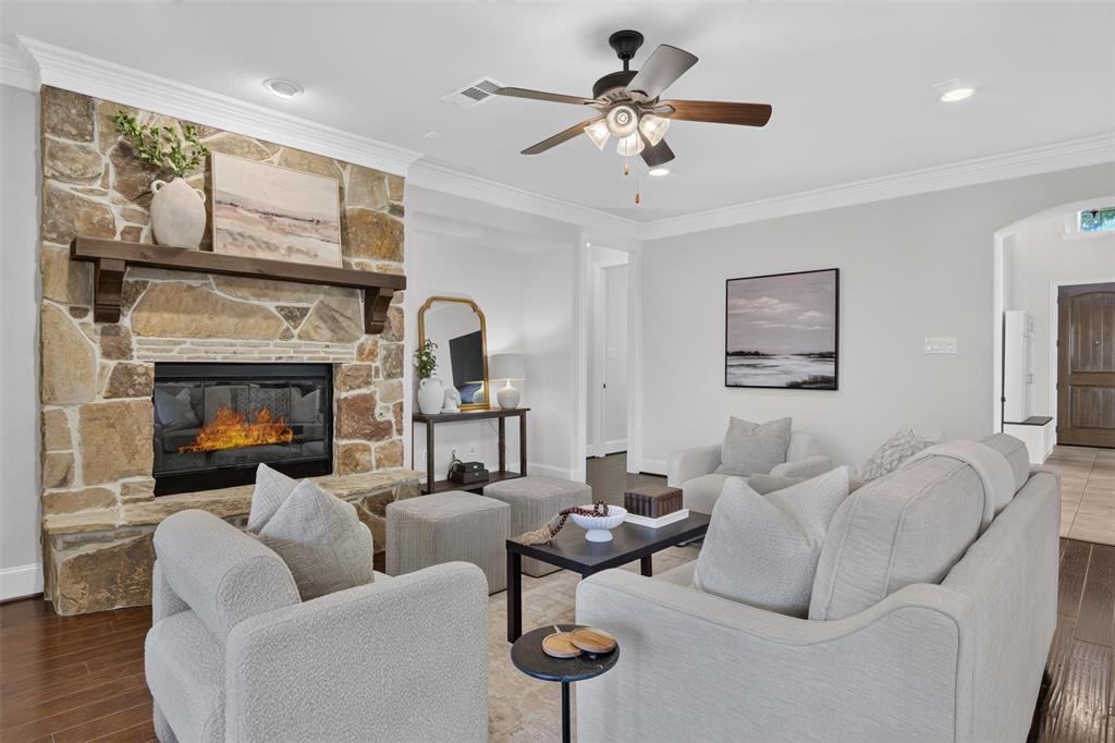 842 Sun Meadow Road Allen, TX 75013 - Photo 8 of 39 Stone-faced fireplace with a wood mantel
