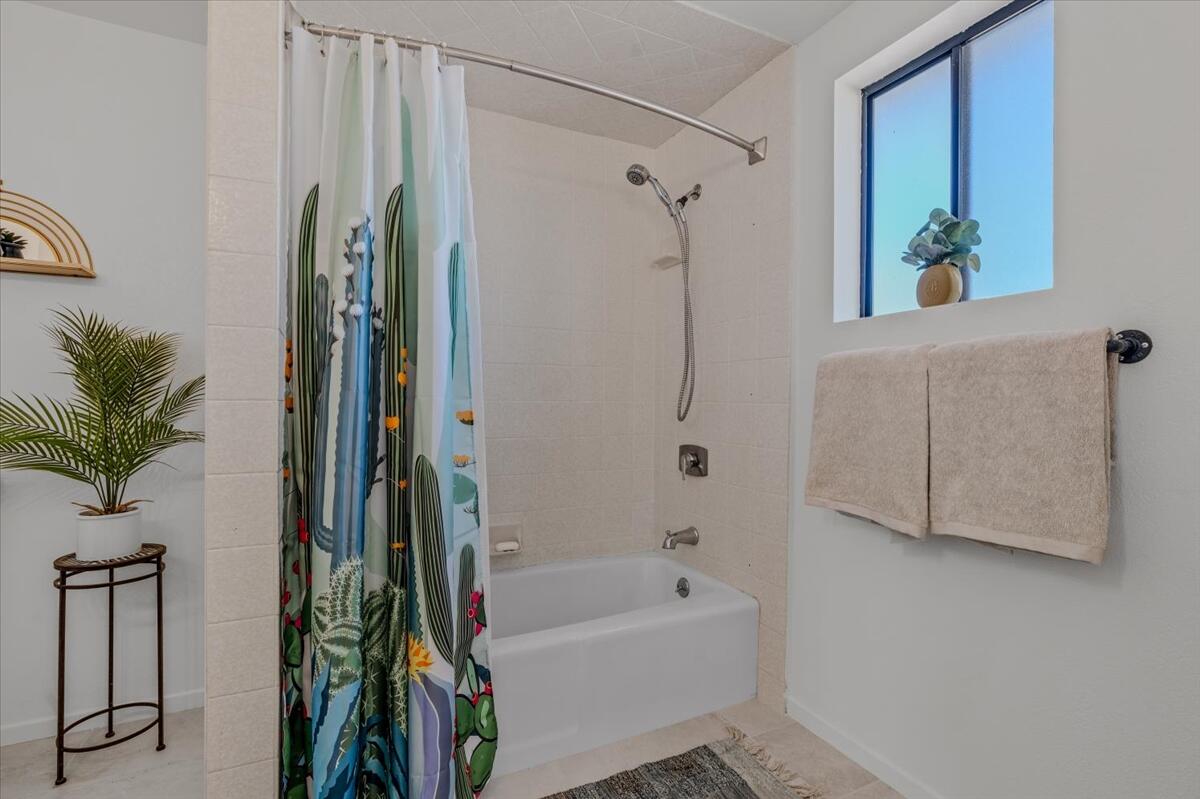 63555 Walpi Drive Joshua Tree, CA 92252 - Photo 16 of 30 a bathroom with a bathtub and a shower