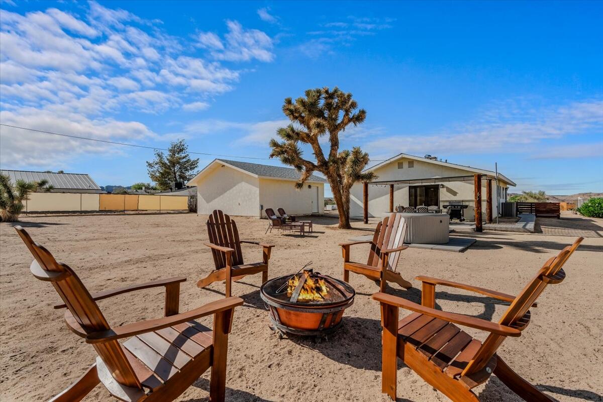 63555 Walpi Drive Joshua Tree, CA 92252 - Photo 24 of 30 a view of a terrace with furniture and a potted plant