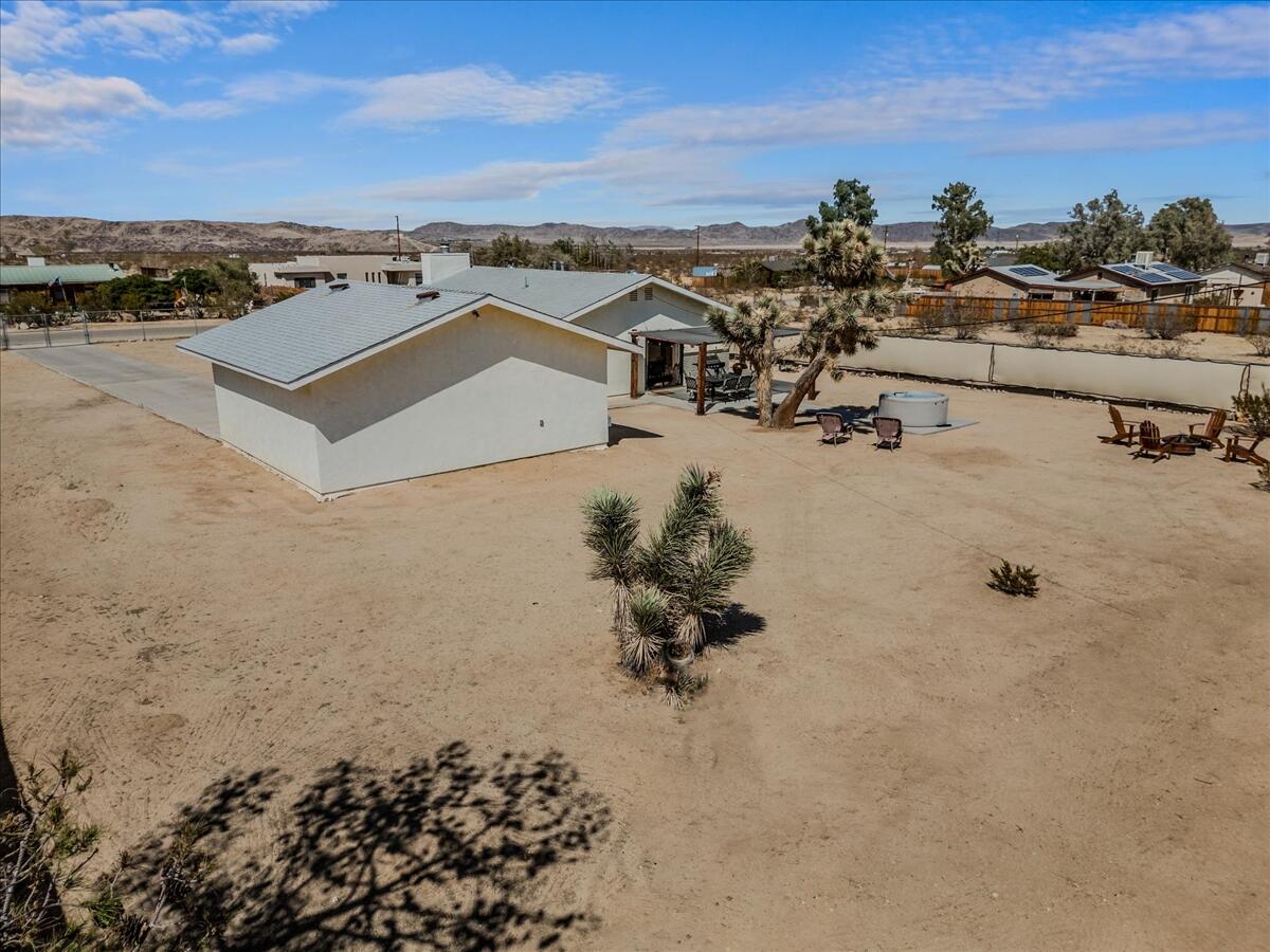 63555 Walpi Drive Joshua Tree, CA 92252 - Photo 27 of 30 an aerial view of a house with a yard