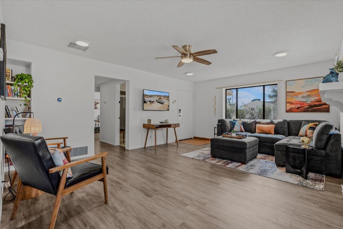 63555 Walpi Drive Joshua Tree, CA 92252 - Photo 7 of 30 a living room with furniture and a window