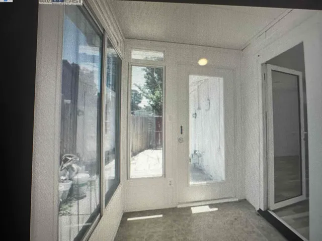 a view of a bathroom with mirror