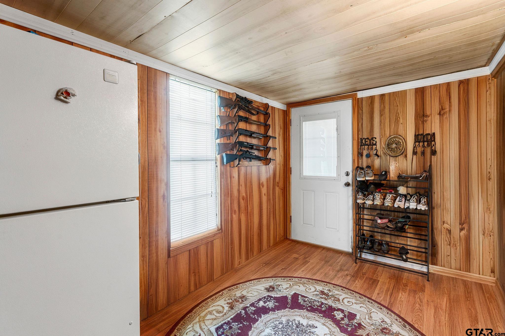 4550 Crabapple Road Gilmer, TX 75645 - Photo 16 of 33 a view of a hallway with wooden floor and closet