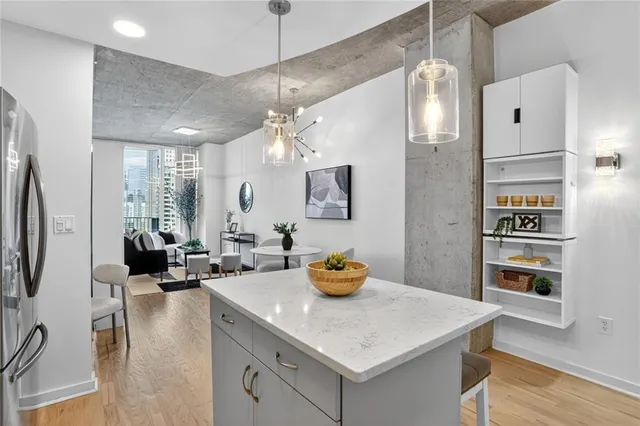 a kitchen with a sink a counter space and stainless steel appliances