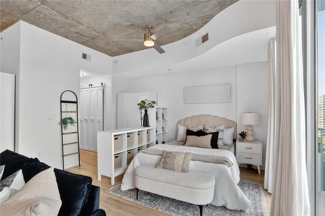 a bedroom with furniture and a window