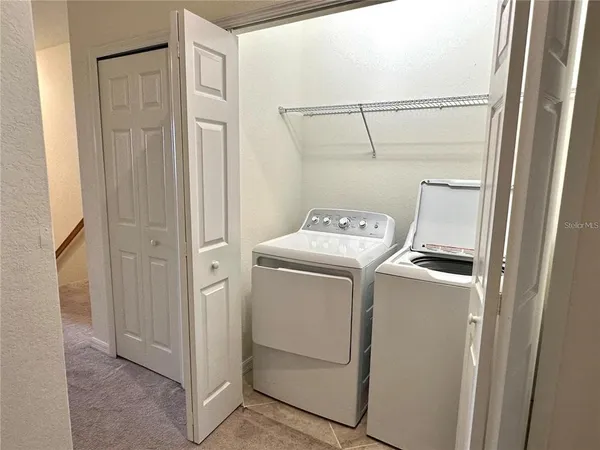 a utility room with dryer and washer