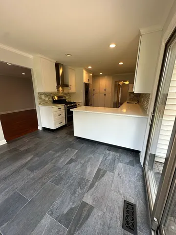 a view of living room with furniture and a flat screen tv