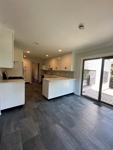 a kitchen with a sink and a refrigerator