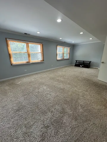 a big room with windows and closet