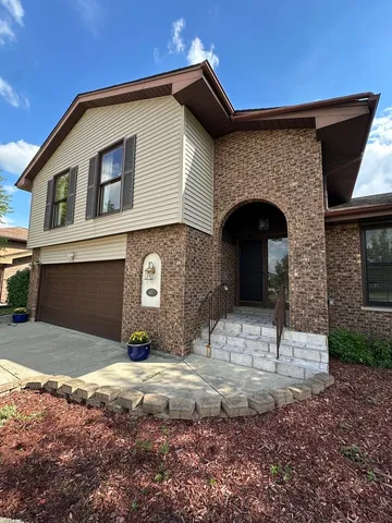 a front view of a house with parking yard