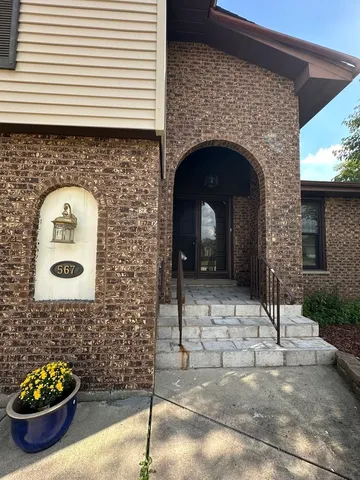 a front view of a house with outdoor space