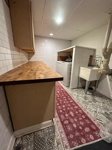 a view of kitchen with furniture and wooden floor