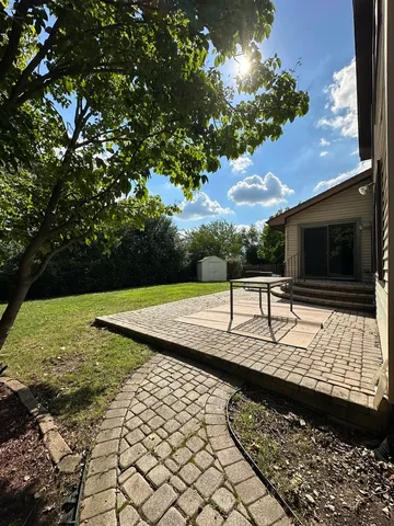 a view of a backyard with a tub