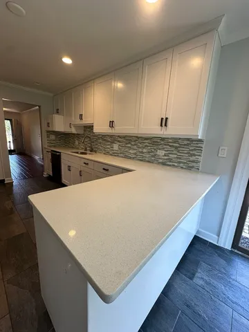 a view of kitchen with wooden floor