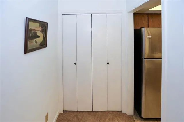 a view of a house with a tree