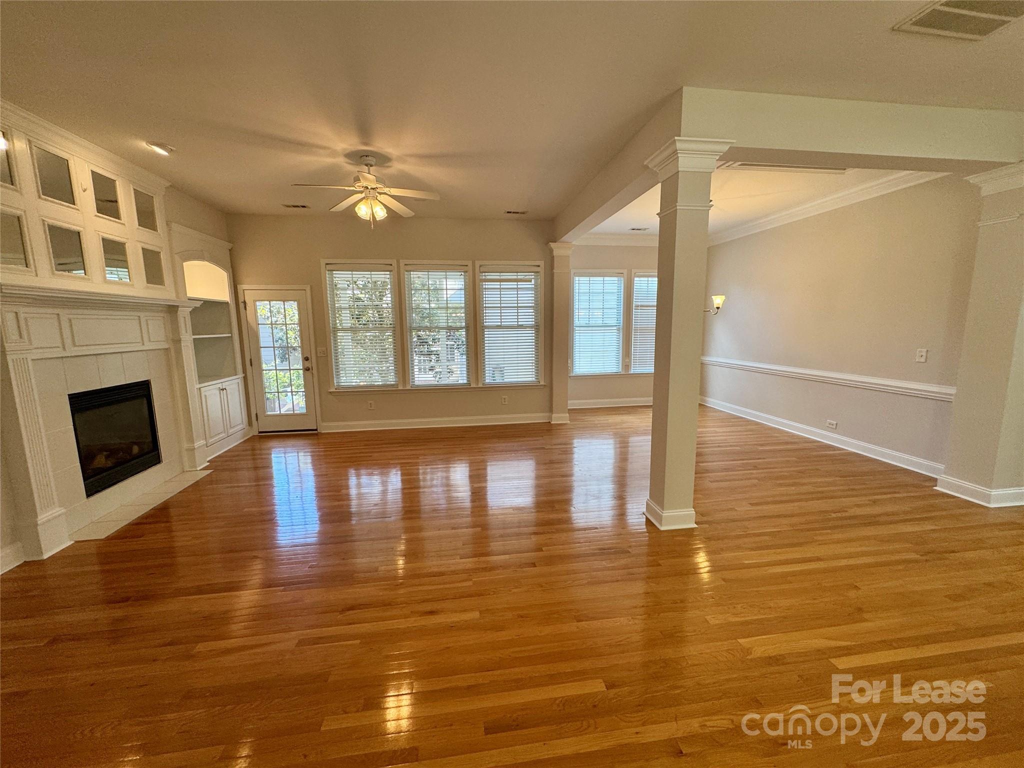 5340 Soaring Eagle Lane Mint Hill, NC 28227 - Photo 13 of 28 a view of empty room with wooden floor and fireplace