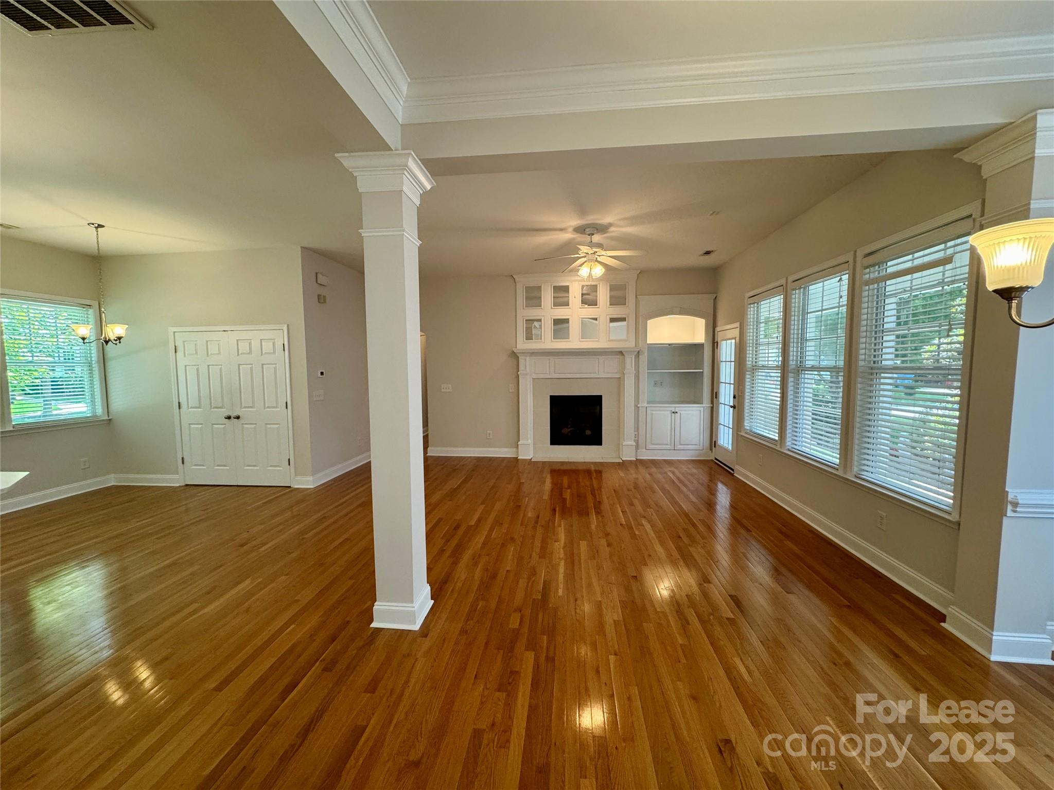 5340 Soaring Eagle Lane Mint Hill, NC 28227 - Photo 14 of 28 a view of empty room with wooden floor and fan