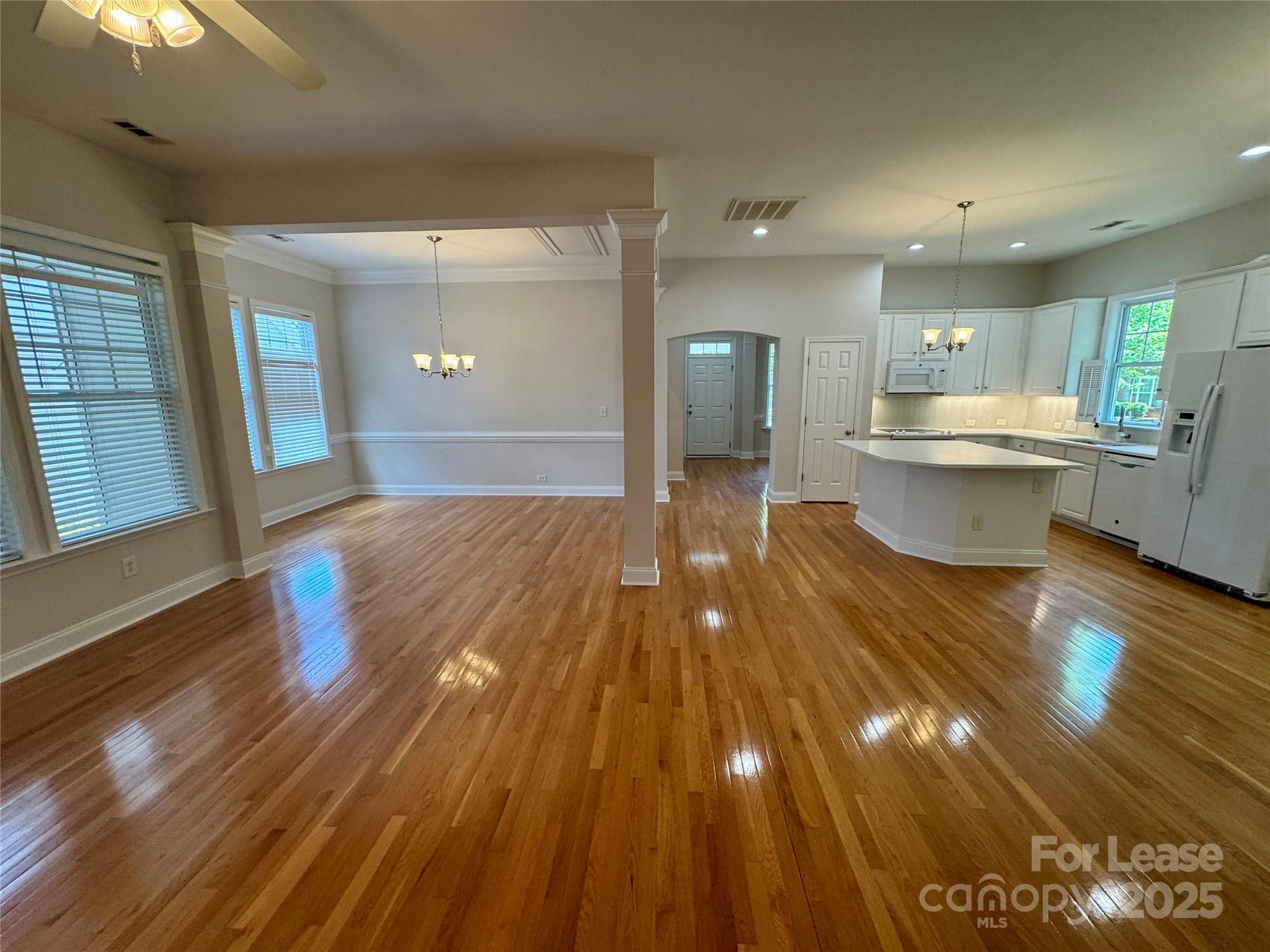 5340 Soaring Eagle Lane Mint Hill, NC 28227 - Photo 16 of 28 a view of a room with wooden floor and potted plant