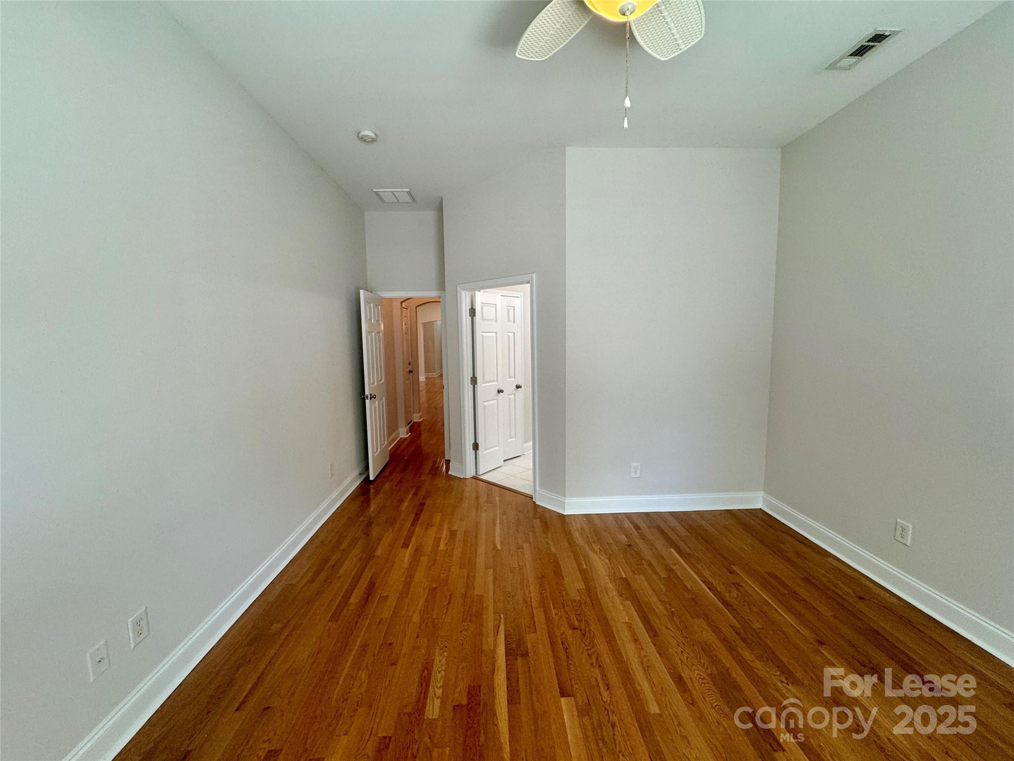 5340 Soaring Eagle Lane Mint Hill, NC 28227 - Photo 23 of 28 a view of an empty room with wooden floor and a window