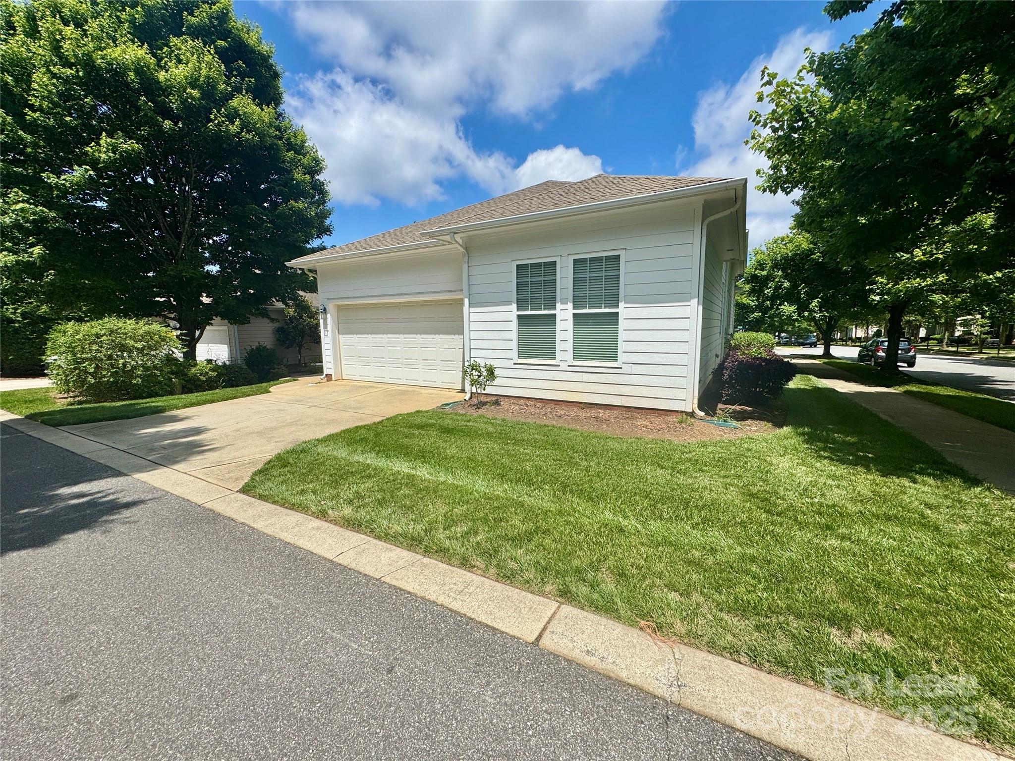 5340 Soaring Eagle Lane Mint Hill, NC 28227 - Photo 3 of 28 a view of a house with a yard and a large tree
