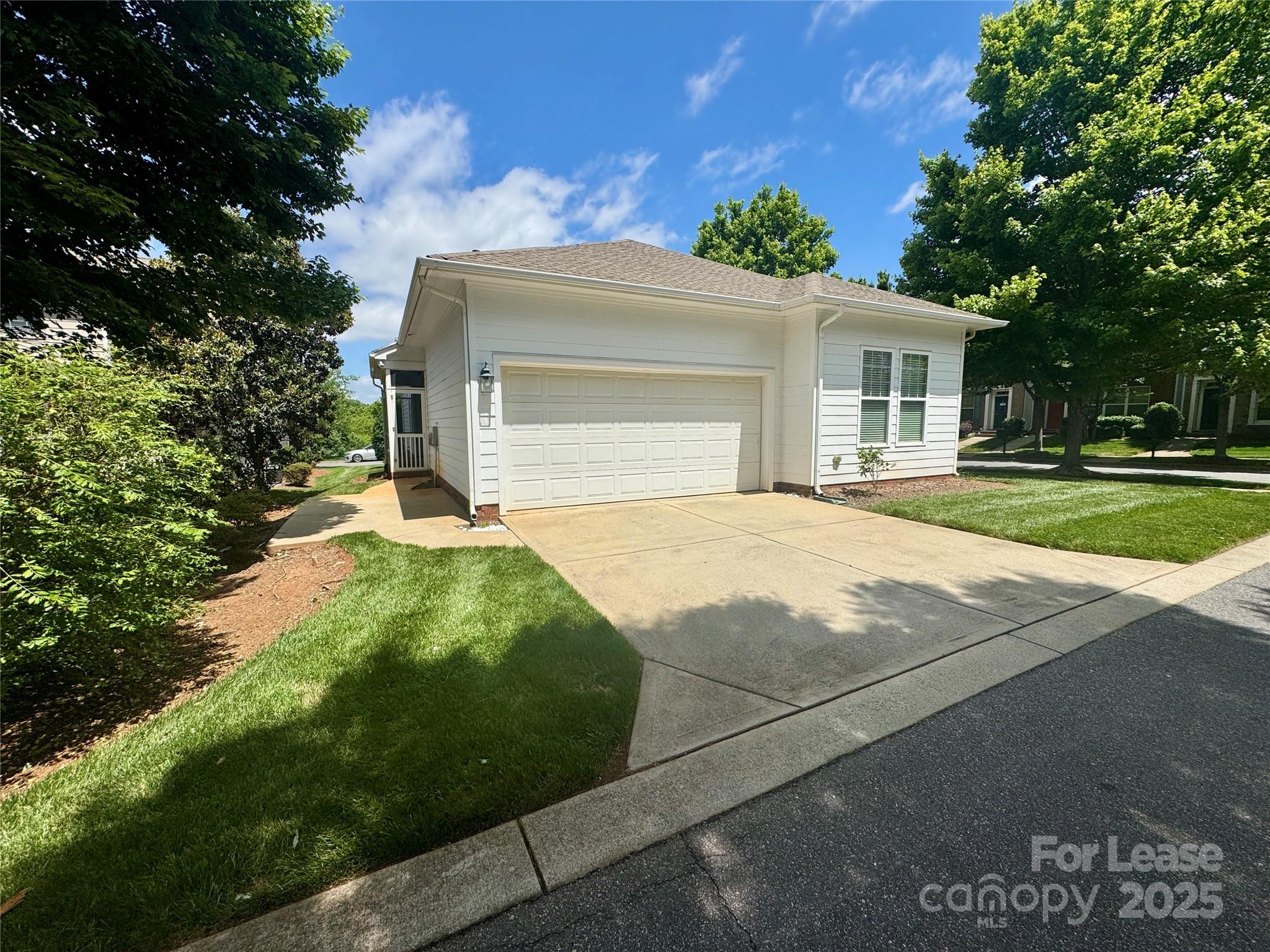 5340 Soaring Eagle Lane Mint Hill, NC 28227 - Photo 4 of 28 a front view of a house with a yard and garage