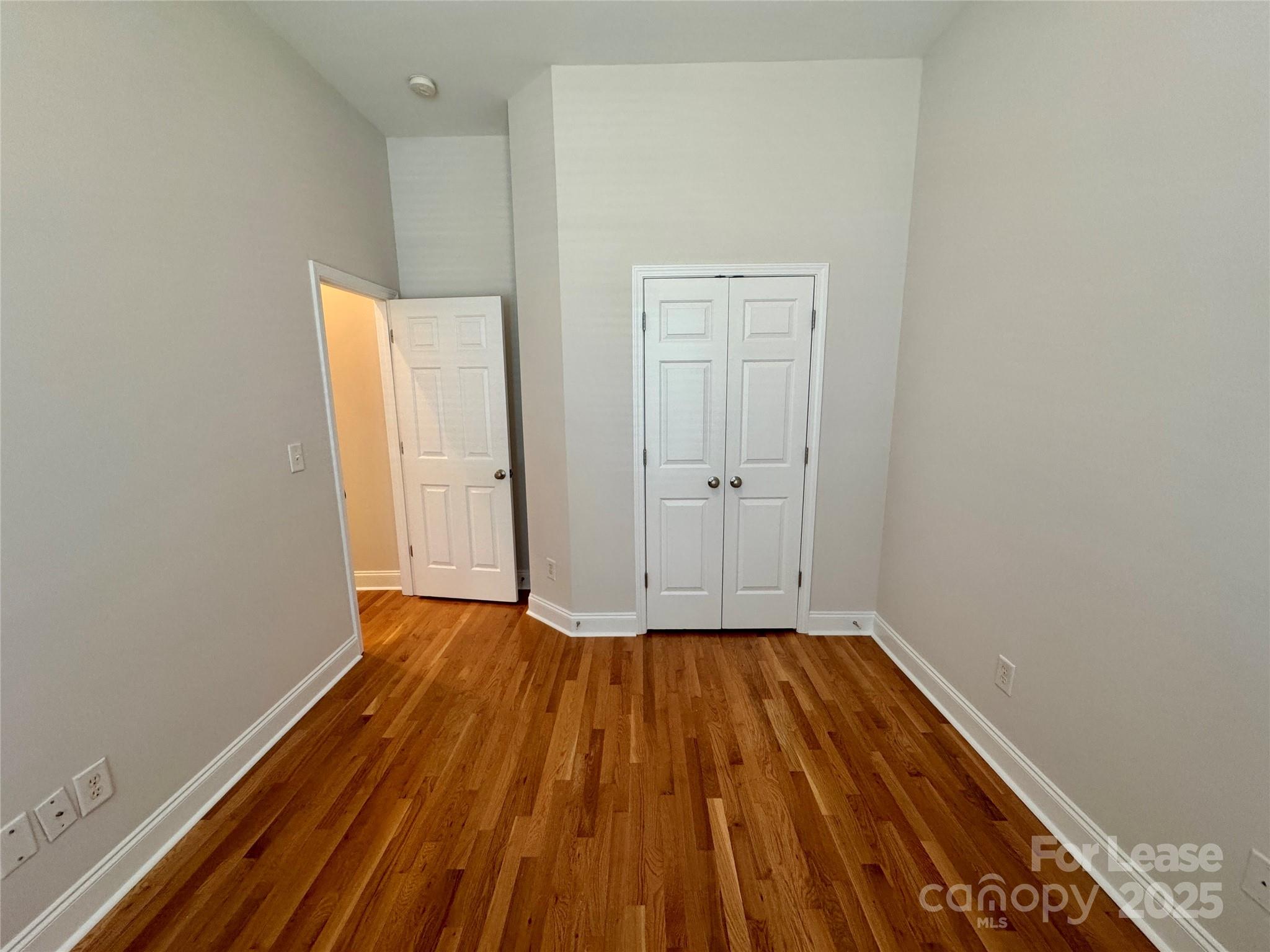 5340 Soaring Eagle Lane Mint Hill, NC 28227 - Photo 10 of 28 a view of a room with wooden floor and white doors