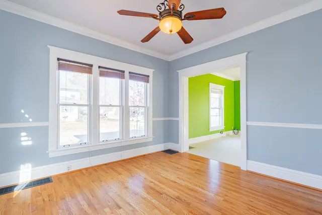 a kitchen with granite countertop a sink stove and cabinets