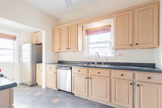 a view of a room with window and stairs