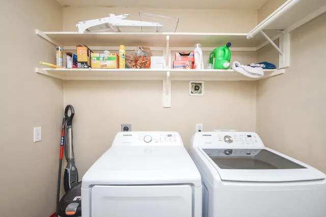 a utility room with dryer and washer