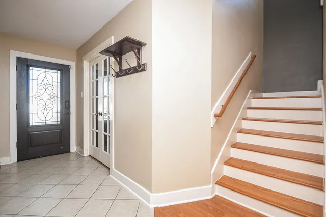 a view of an entryway with stairs