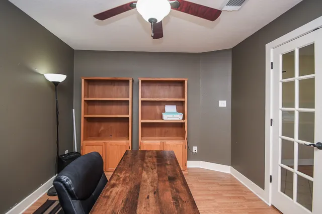 a view of a livingroom with a furniture and wooden floor