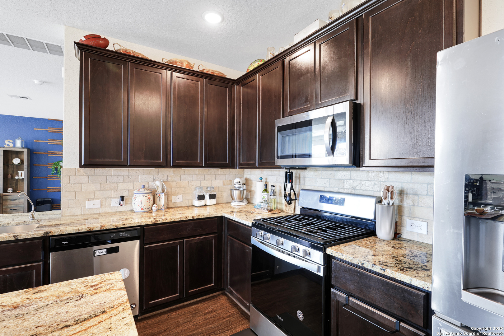 10614 Rosalina Loop Converse, TX 78109 - Photo 14 of 31 a kitchen with a sink stove and microwave