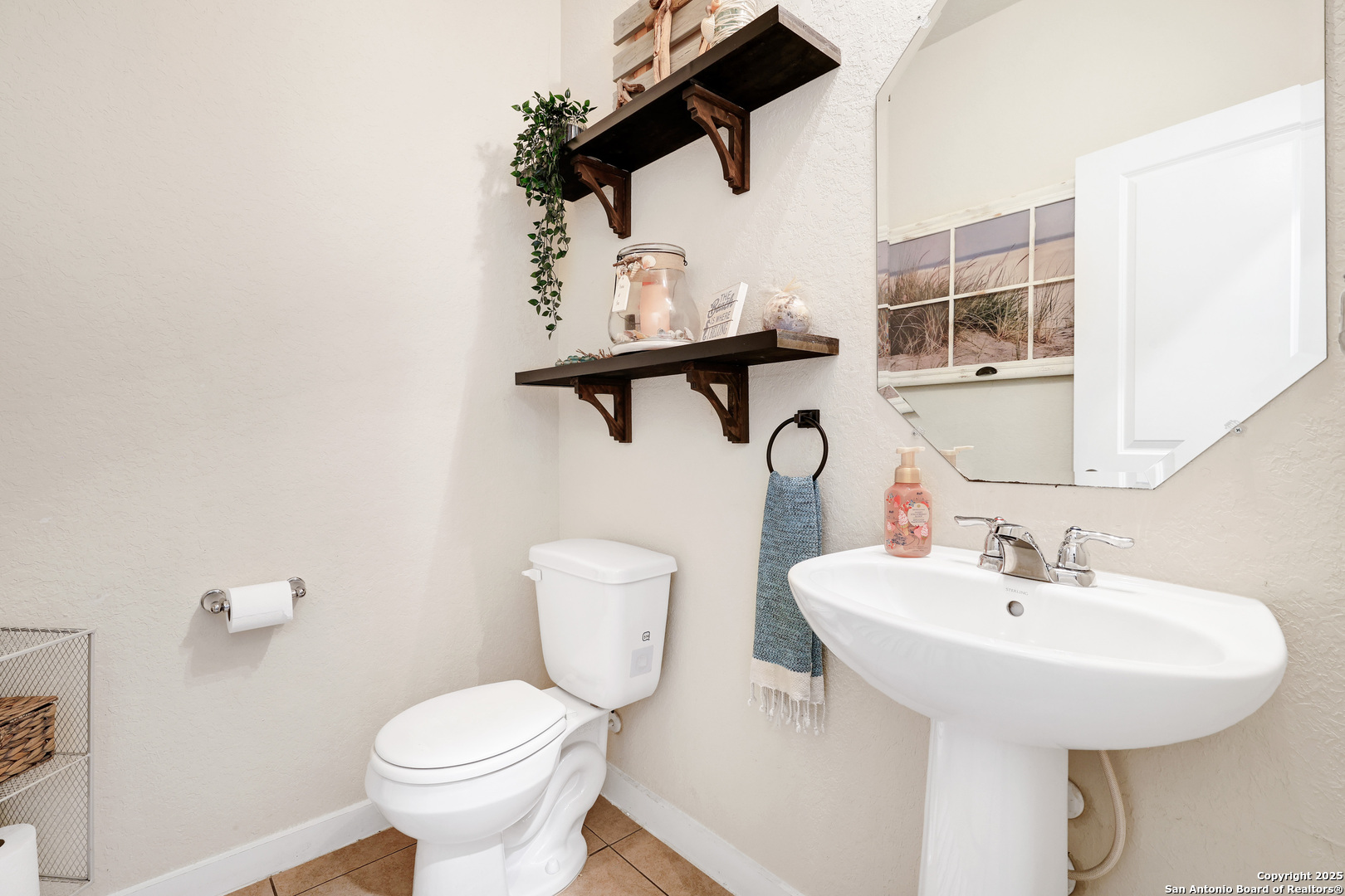 10614 Rosalina Loop Converse, TX 78109 - Photo 17 of 31 a bathroom with a sink toilet and a mirror