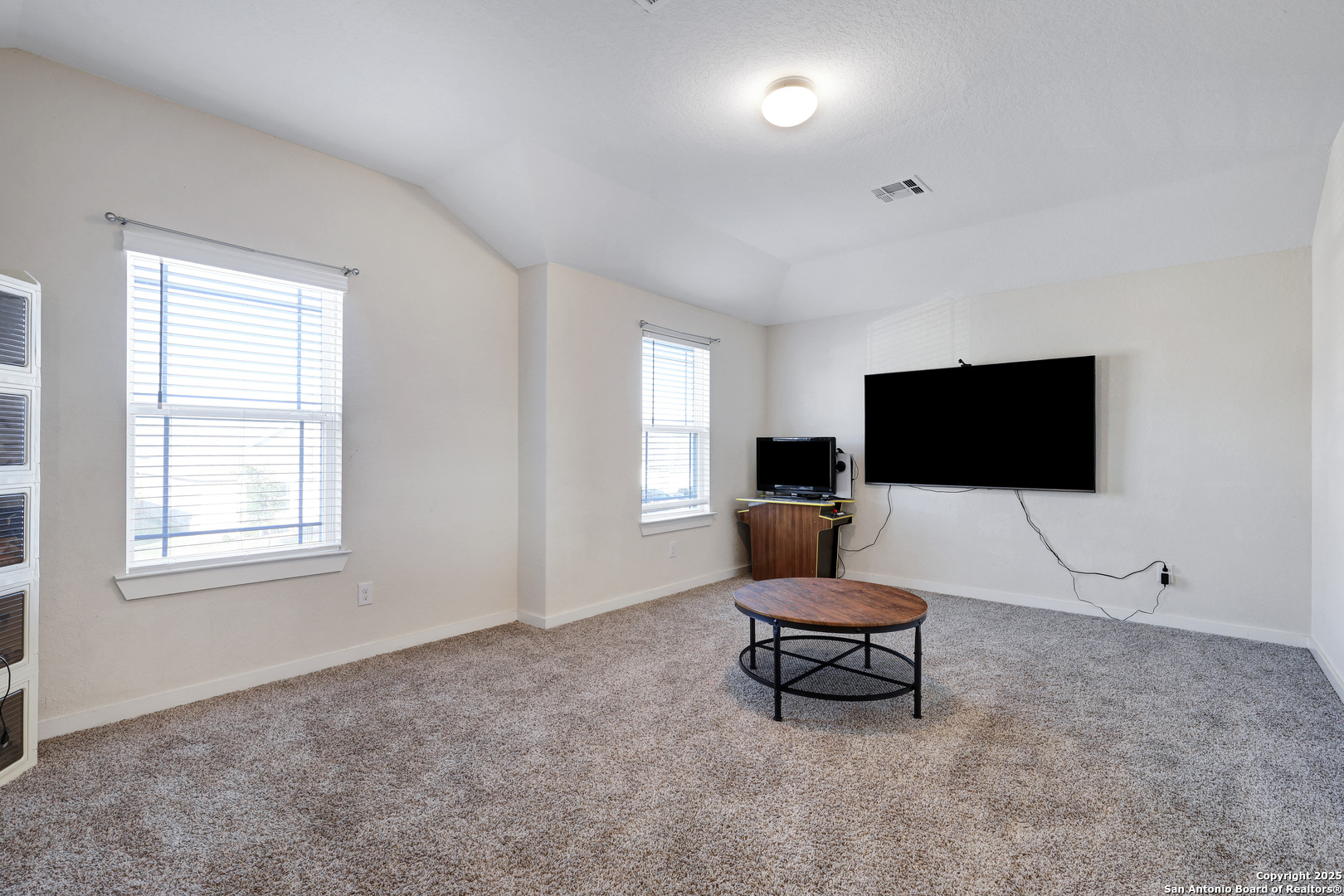 10614 Rosalina Loop Converse, TX 78109 - Photo 19 of 31 a living room with furniture and a flat screen tv
