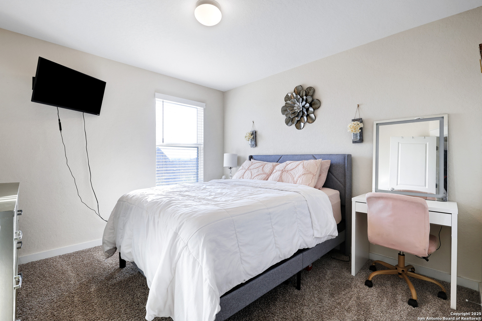 10614 Rosalina Loop Converse, TX 78109 - Photo 28 of 31 a bedroom with a bed and a flat screen tv