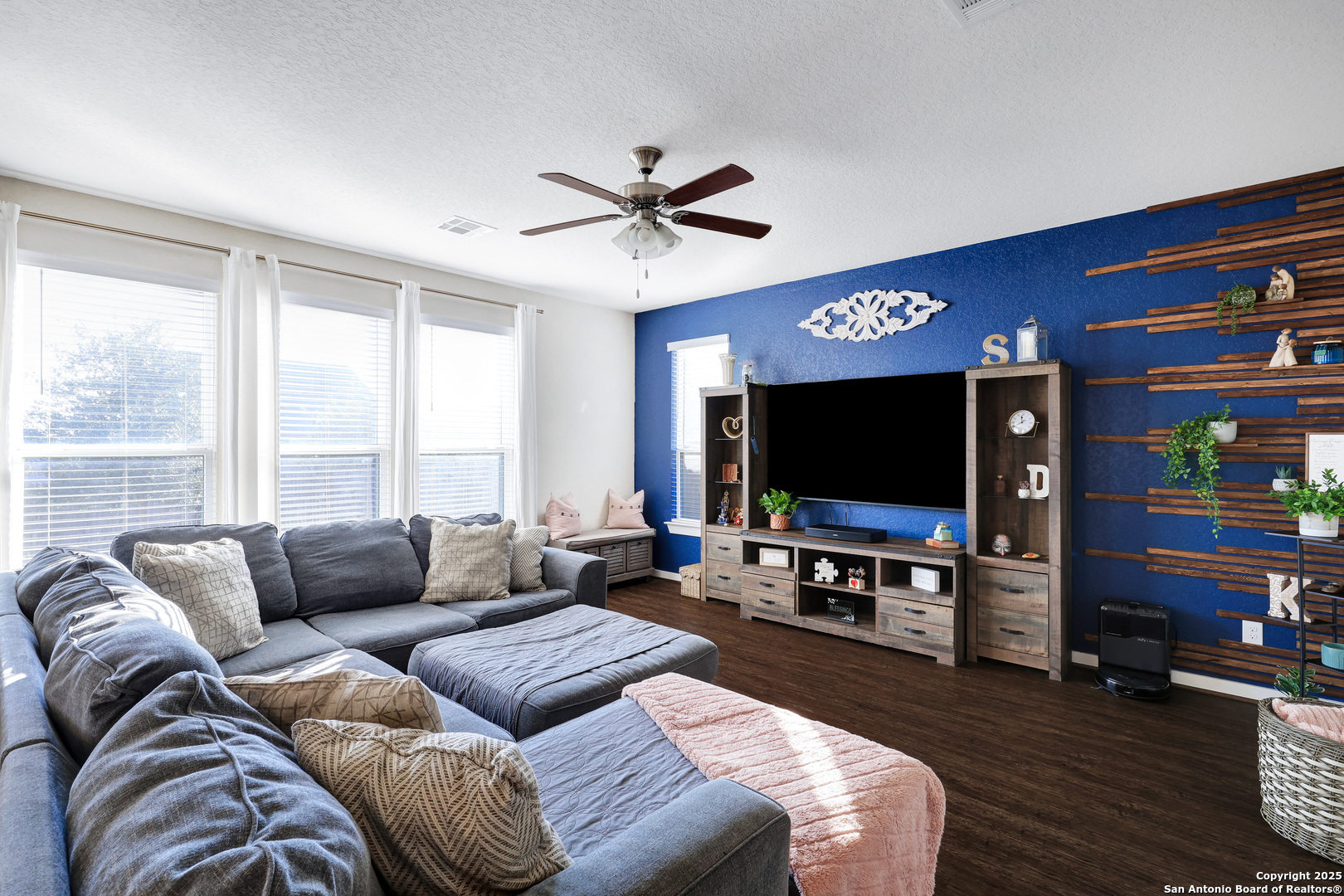 10614 Rosalina Loop Converse, TX 78109 - Photo 4 of 31 a living room with furniture and a flat screen tv