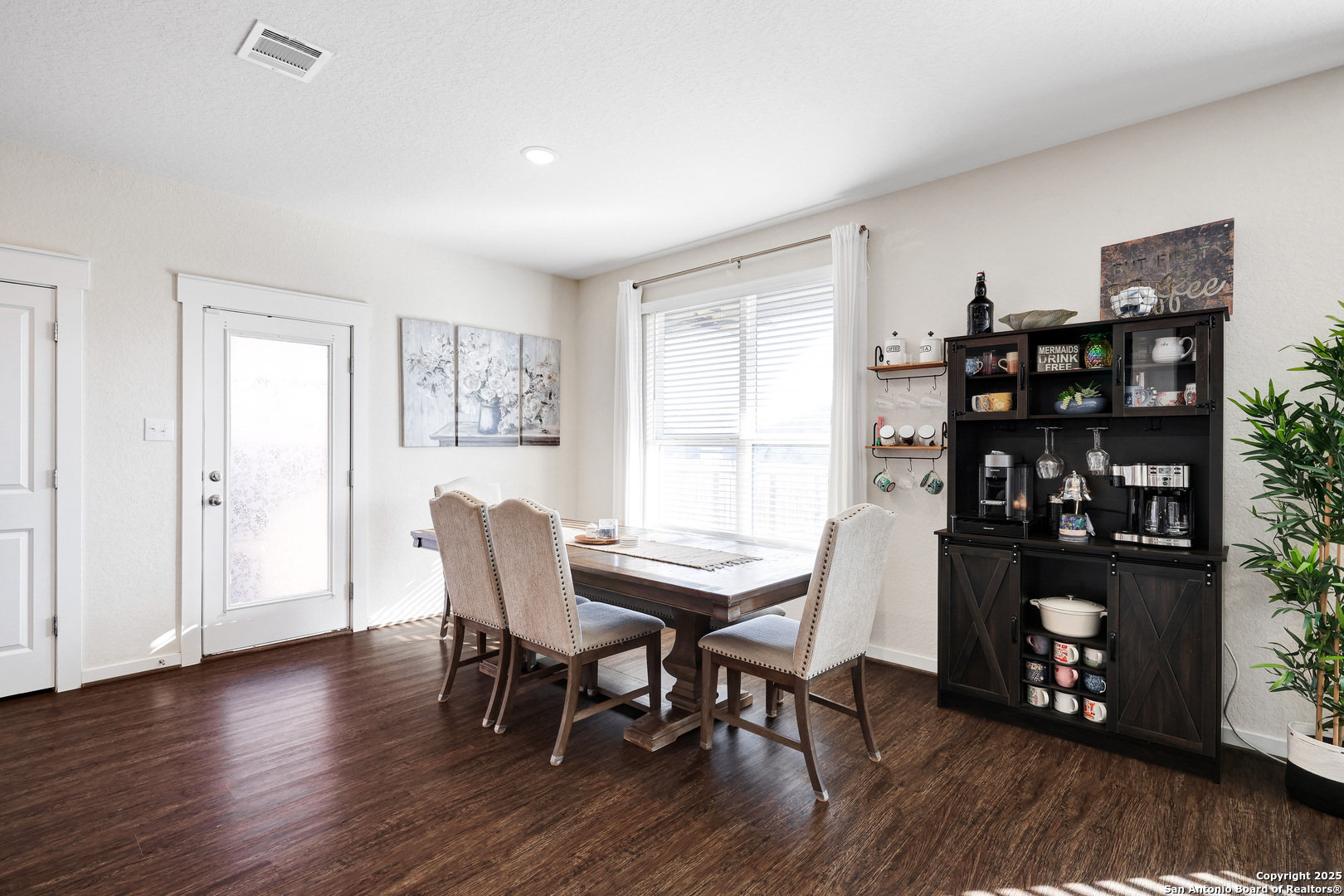 10614 Rosalina Loop Converse, TX 78109 - Photo 8 of 31 a view of a dining room with furniture and wooden floor